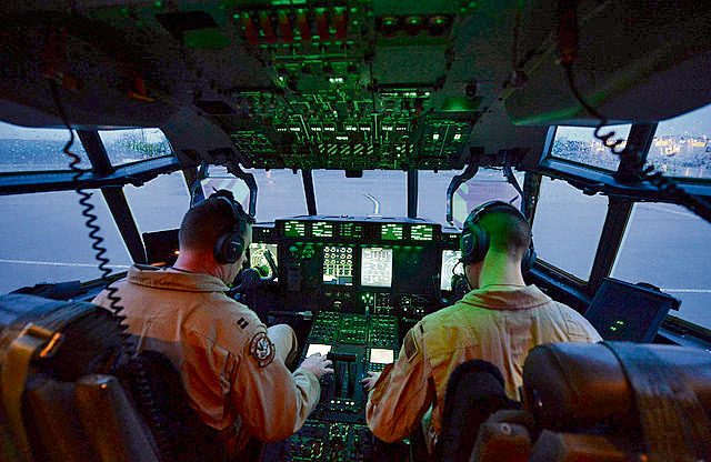 Capt. Frank Zientek (left) and 1st Lt. Christopher Reith, 37th Airlift Squadron pilots, complete their preflight checks for a C-130J Hercules prior to take off from Ramstein April 26.  The Airmen are part of a six-man flightcrew entrusted with transporting the aircraft to the 2016 International Marrakech Air Show in Morocco.