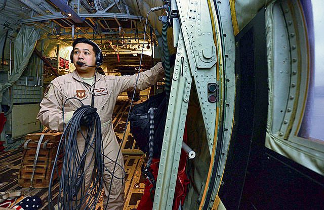 Tech. Sgt. Gregory Flores, 37th Airlift Squadron loadmaster, communicates with the other aircrew during preflight checks on a C-130J Hercules prior to take off from Ramstein April 26.