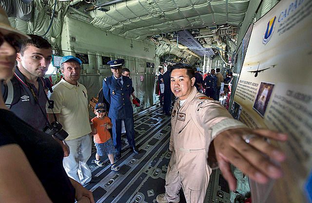 Tech. Sgt. Gregory Flores, 37th Airlift Squadron loadmaster, describes the capabilities of a C-130J Hercules to spectators during the International Marrakech Air Show April 30 in Morocco.