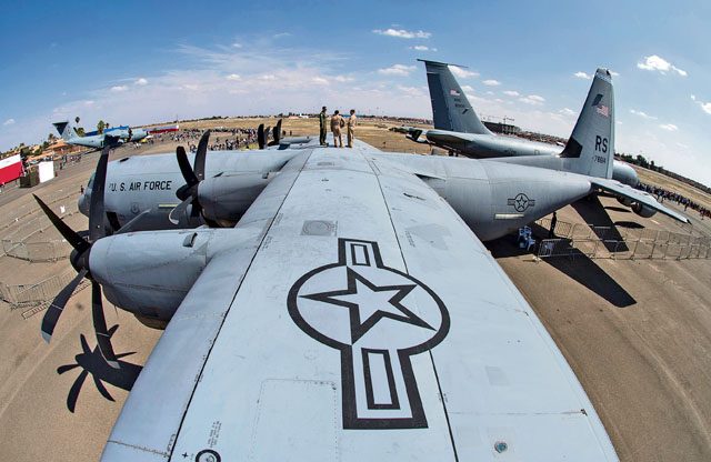 Crew members stand on the top of a C-130J Hercules during the International Marrakech Air Show April 30 in Morocco.