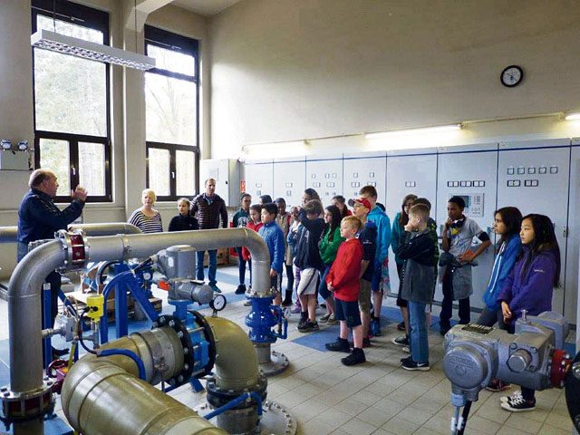 Photo by Johnette Scott RMS visits base water plant Axel Christmann, 86th Civil Engineering Squadron environmental protection specialist, speaks with Johnette Scott’s sixth-grade science class from Ramstein Middle School during their visit to Ramstein’s water plant April 22. Christmann briefed the students on the plant’s operations and importance to the overall mission and quality of life.  The visit was one of several planned to base facilities in conjunction with the school’s the science curriculum.