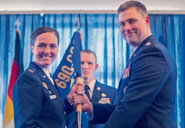 Col. Heather Blackwell, 690th Cyberspace Operations Group commander, passes the guidon to Lt. Col. Michael Medgyessy during the 691st Cyberspace Operations Squadron activation ceremony April 21 on Ramstein. Due to the cyberspace environment constantly evolving, the 691st COS team have the intent to strengthen the new unit by maturing its capabilities and growing the Cyber Security and Control System weapon system and the operational capabilities of the unit. 