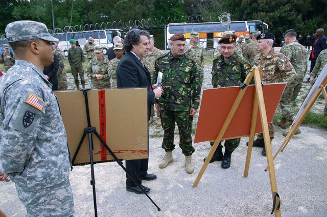 Roberto Casalini, Marine Operations director at Camp Darby, Italy, explains future plans to improve Tumbelo Dock along the Navicelli Canal to logisticians attending the Southern Sustainment Terrain Walk April 28. The dock is used to load munitions and equipment to take to the port of Livorno for shipment.