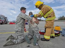 First responders assist a simulated missile-attack casualty during the Wing Thunder inspection April 26 on Ramstein. The first responders arrived on scene first to ensure the scene was safe and all victims were helped in a timely matter.
