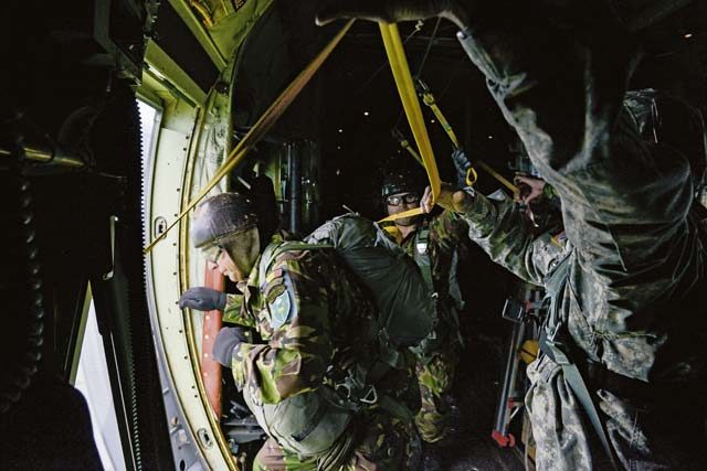 Romanian airmen jump out of a C-130J Super Hercules during exercise Carpathian Spring May 10 over Romania. The exercise was a bilateral training event aimed to enhance interoperability and readiness with Romania by conducting air operations. 