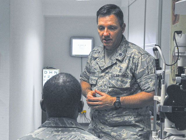 Lt. Col. Neil Horner, 86th Aerospace Medicine Squadron optometry flight commander (right), speaks to Senior Airman Jonathan Robins, 1st Combat Communications Squadron maintenance operations center technician, about his eye health June 23 on Ramstein. The clinic is the largest in U.S. Air Forces in Europe, offering assistance and care to more than 54,000 Americans. 