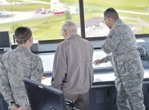Retired Chief Master Sgt. Kenneth Andrews meets with several Ramstein Airmen during a visit to the air traffic control tower May 24 on Ramstein. Andrews had the opportunity to speak to the controllers on duty that day and share with them his background as a 30-year retired traffic controller. Andrews entered the Air Force in 1947 and retired in 1977 after having served in several combat roles during his military career.