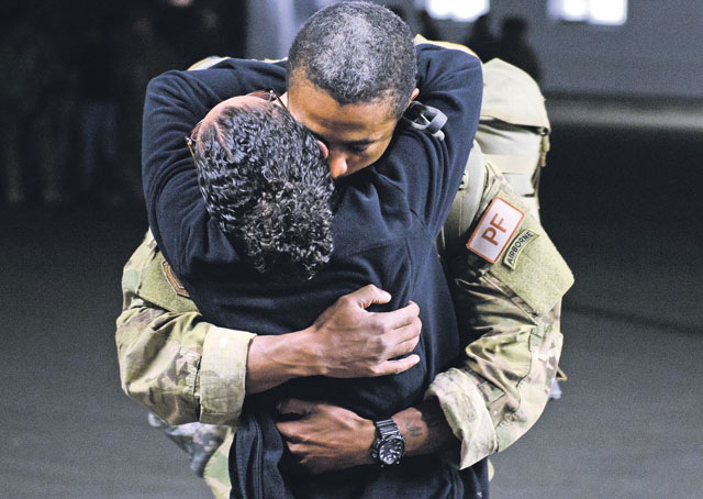 Photo by Staff Sgt. Armando A. Schwier-MoralesA couple embraces after the return of the Airman May 8 on Ramstein. Airmen from Ramstein’s 435th Air Ground Operations Wing deployed to quickly improve infrastructure of a bare base in Africa to ensure its readiness for follow-on forces.