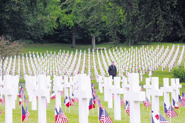 Philip George, 21st Theater Sustainment Company mortuary affairs, views gravesites during a Memorial Day ceremony May 29 at Lorraine American Cemetery and Memorial in St. Avold, France. More than 10,000 Americans are buried in the cemetery, the largest American World War II cemetery in Europe.