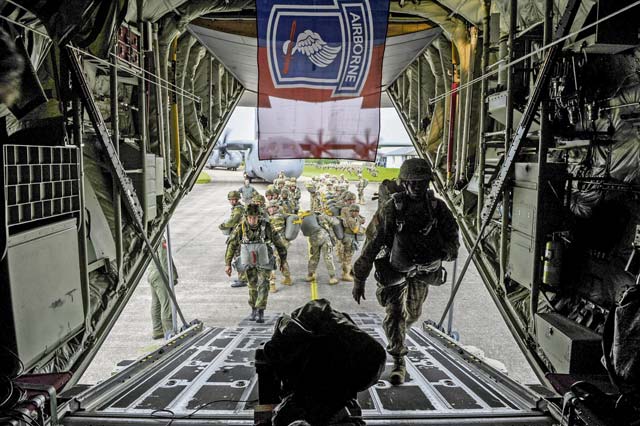 American and German soldiers board a U.S. Air Force C-130J Super Hercules June 5 in Cherbourg, France. 