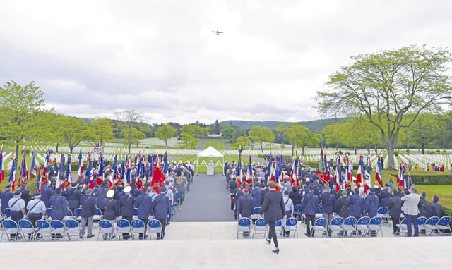 A 37th Airlift Squadron C-130J Super Hercules flies over a Memorial Day ceremony May 29 at Lorraine American Cemetery and Memorial in St. Avold, France. The flyover renders honor to those buried in the cemetery.