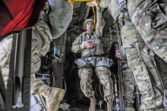 Soldiers exit a C-130J Super Hercules assigned to the 37th Airlift Squadron at Ramstein June 5 during an airborne operation over the Normandy region of France. 