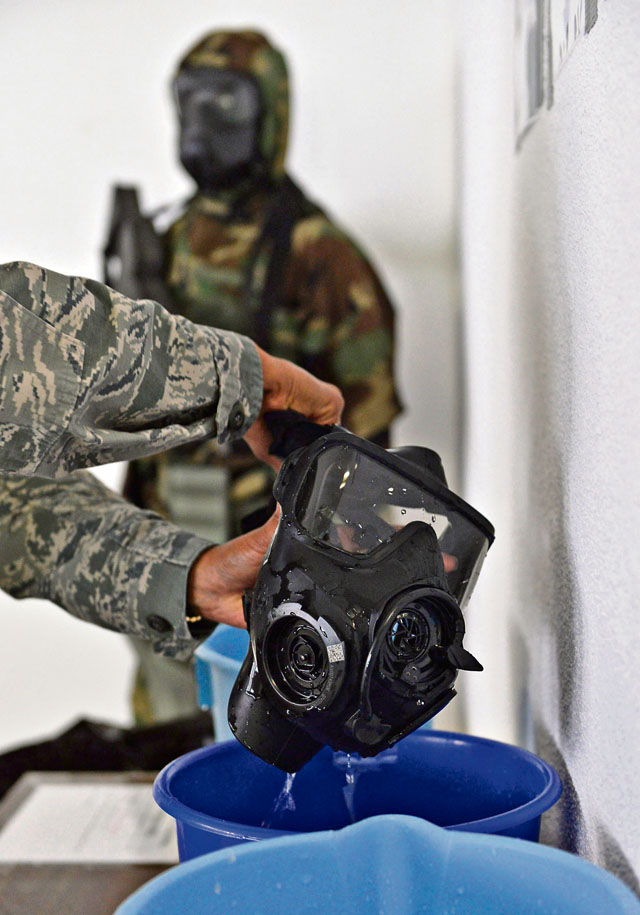 Senior Airman Andrea Vasquez, 86th Medical Support Squadron medical lab technician, cleans her gas mask July 15 on Ramstein. The 86th Logistics Readiness Squadron Individual Protective Equipment Element is currently working additional shifts to inspect all issued M-50 gas masks for leaks by Saturday.