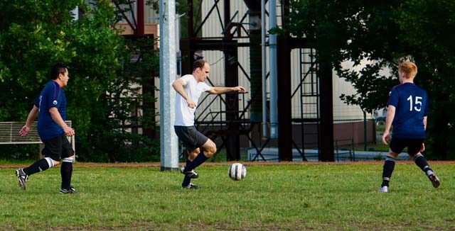 Maj. Casey Chronister, 76th Airlift Squadron C-21 instructor pilot, runs down the soccer field during the Ramstein intramural soccer finals June 29, 2016, at Ramstein Air Base, Germany. After the full season ends, all participating units compete in a tournament-style final where teams play double-elimination matches until one team is left.