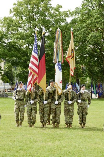 Photo by Gregory JonesA color guard representing the 405th Army Field Support Brigade bears organizational, service and national banners during the change of command and responsibility ceremony held July 11 at NCO Field on Daenner Kaserne.