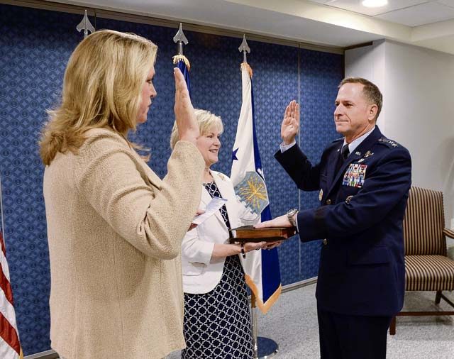 Photo by Andy Morataya  Air Force Secretary Deborah Lee James reads the oath of office to Air Force Chief of Staff Gen. David L. Goldfein as his wife, Dawn, holds the chief of staff Bible during a swearing-in ceremony at the Pentagon in Washington, D.C., July 1, 2016. Goldfein became the 21st chief of staff of the Air Force. 
