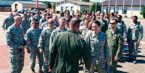 Airmen approach Brig. Gen. Jon T. Thomas, 86th Airlift Wing commander, after his “fini flight” July 21 on Ramstein. Airmen traditionally come out to greet their commanders after their final flight.