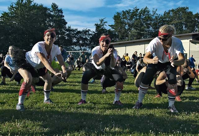Mudless Mudder participants perform squats during a warm-up July 8, 2016, at Ramstein Air Base. More than 98 teams signed-up to compete in the five-kilometer obstacle course for Resilience Day. 