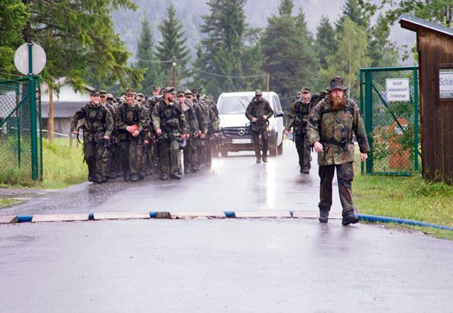 After a long day of rain, rucking and climbing, Soldiers from the 18th Military Police Brigade and German army return to their home base during exercise Alpendistel 2016. The two-day German mountain warfare training exercise took place July 20 to 21 and July 27 to 28 in Bad Reichenhall, Germany. The exercise is designed to challenge the physical and mental toughness of the participants as well as prove their proficiency in mountain operations. The teams were led by specially trained instructors from the German army’s 23rd Mountain Brigade.