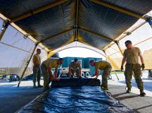 Airmen from the 435th Contingency Response Group take down a Tent Model 60 tent during training July 18 on Ramstein. The Airmen repeated the process of assembling and disassembling the tent several times in order to familiarize themselves with the new system.