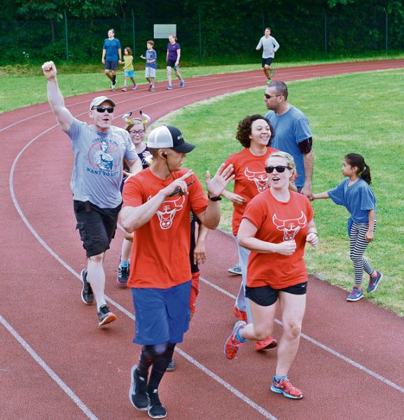 Runners celebrate finishing their last lap during the Viking Challenge July 23 on Pulaski Barracks. After the marathon ended, awards and appreciation were given out.