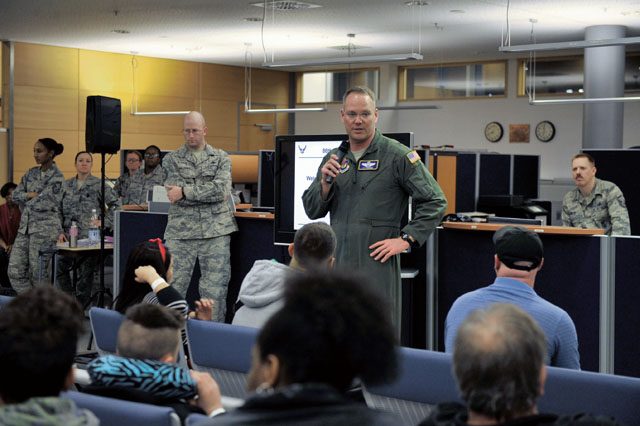 Photo by Senior Airman Larissa Greatwood Brig. Gen. Jon T. Thomas, 86th Airlift Wing commander, talks to families arriving from Turkey about what agencies are available to assist during their transitions March 31 on Ramstein. Many Airmen and civilians came together to provide child care, transportation, medical assistance and essentials to families evacuating military bases in Turkey. 