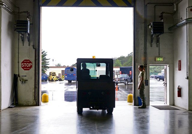 A tug vehicle exits a maintenance shop of the 86th Vehicle Readiness Squadron July 13 on Ramstein Air Base. Tugs are used to push vehicles with mechanical issues to areas where they are maintained.