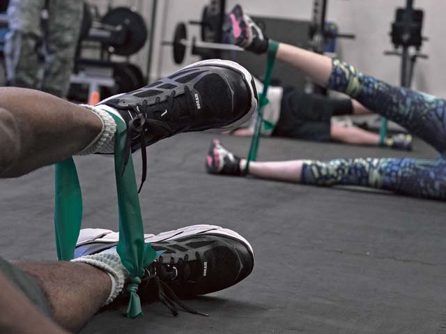 Master Sgt. Kendrick Lucas, left, 86th Security Forces Squadron flight chief, performs exercises during a knee rehabilitation class at Ramstein Air Base, Aug. 2, 2016. The 86th Medical Operations Squadron Physical Therapy Clinic hosts the knee and back rehabilitation classes, which aim to instruct patrons on proper forms to strengthen and heal chronic or acute injuries.  