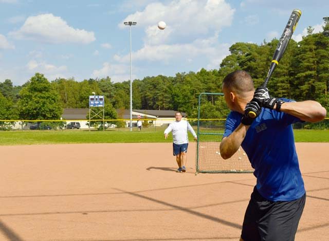 Photo by Staff Sgt. Sharida Jackson Capt. Greg Ihlenberg, 76th Airlift Squadron C-21 evaluator pilot, participates in the home run derby during the Commander’s Challenge Sept. 23 on Ramstein. The Commander’s Challenge also included basketball, softball, kickball, dodgeball, football, soccer and volleyball tournaments.