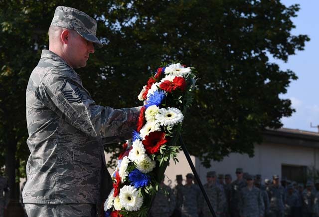 Master Sgt. Jesse Burkard, 86th Civil Engineer Squadron fire protection superintendent, lays a wreath during a 9/11 memorial retreat ceremony Sept. 9 on Ramstein. During the attacks, 2,977 people lost their lives and over 6,000 were injured, resulting in the largest domestic terrorist attack in U.S. history.