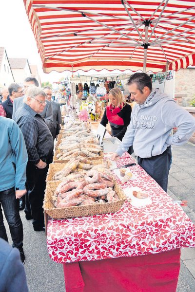 Vendors and farmers sell their products at the farmers market Sunday in Schneckenhausen.