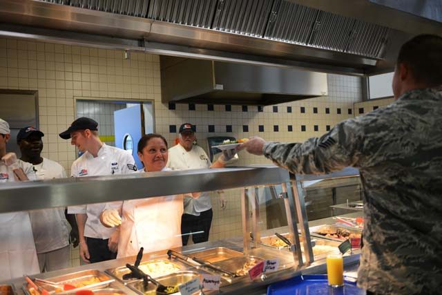 Mabel Raab, 786th Force Support Squadron cook helper, serves an Airman at the Lindberg Hof Dining Facility Aug. 30 on Kapaun. The 786 FSS falls under the 86th Mission Support Group.