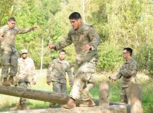Soldiers from the 554th Military Police Company had to balance on the logs as part of an obstacle course during the Clifton Challenge Sept. 1 at Boeblingen Local Training Area, Germany. Soldiers participated in the Clifton Challenge to honor Cpl. Karen Clifton who died in Baghdad, Iraq, in 2007.
