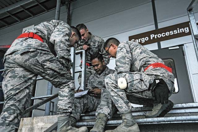 Airmen assigned to the 86th Logistics Readiness Squadron take a knowledge test during the 2016 European Port Dawg Rodeo Sept. 17 on Ramstein. In addition to the knowledge test, Airmen from the 86th Airlift Wing, 435th Air Ground Operations Wing and 521st Air Mobility Operations Wing competed in physical activities related to their job to earn bragging rights as being the best of the best.