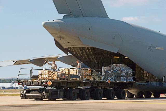 Airmen from the 721st Aerial Port Squadron load a C-17 Globemaster III Sept. 7 on Ramstein. The 721 APS broke a record July 27 loading 120 tons of cargo onto a Boeing 747, the highest allowable cargo load utilized on any commercial aircraft.