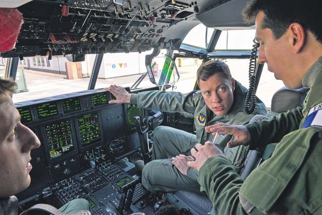 Photo by Airman 1st Class Lane Plummer  U.S. and French Airmen discuss the features of a C-130J Super Hercules aircraft cockpit April 28 on Ramstein.  Aircraft from the 86th Operations Group get prepared for flight almost daily to meet training requirements and mission objectives.
