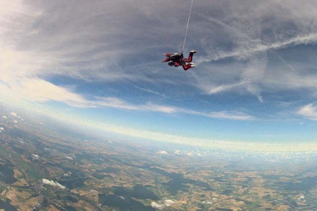 Courtesy photo  Senior Airman Nicole Keim, 86th Airlift Wing Public Affairs photojournalist, and a skydiver jump out of an airplane Aug. 13 over Wallerfangen, Germany. 