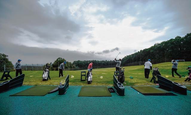 Airmen and Soldiers from the KMC warm up before the Army and Air Force Challenge Match golf tournament Sept. 18 at Rheinblick Golf Course in Wiesbaden, Germany. The annual tournament is open to service-affiliated members of the Air Force and Army.