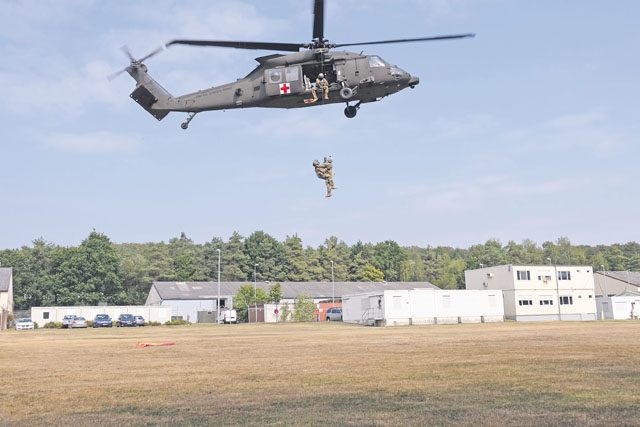 Seventh Mission Support Command Soldiers from the Medical Support Unit-Europe conduct medical evacuation training with the 1st Armored Division’s Combat Aviation Brigade Sept. 9 at NCO Field on Daenner Kaserne.