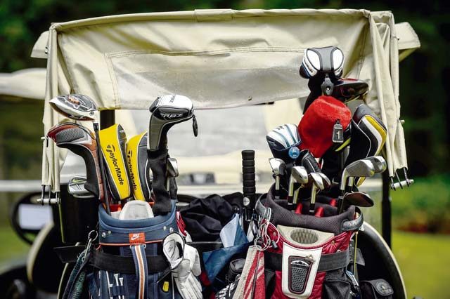 Golf clubs rest in the back of a golf cart during the Army and Air Force Challenge Match golf tournament Sept. 18 at Rheinblick Golf Course in Wiesbaden, Germany.