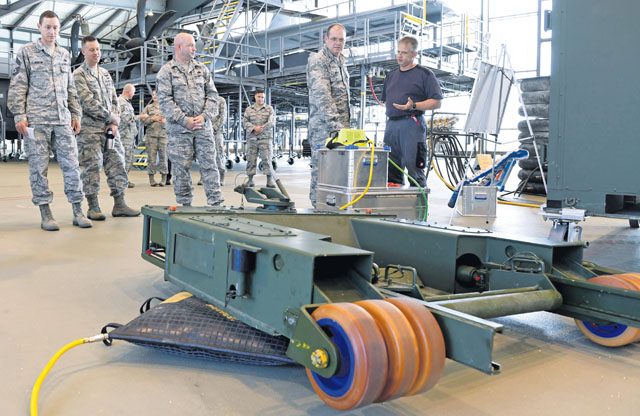 Tino Weichel, 86th Maintenance Squadron aero repair aircraft mechanic, describes capabilities of the 86th Maintenance Group to Brig. Gen. Richard G. Moore Jr., 86th Airlift Wing commander, during a demonstration Aug. 31 on Ramstein. The 86 MXG maintains U.S. Air Forces in Europe's only assigned distinguished visitor airlift and 24/7 aeromedical evacuation operations.