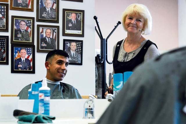 Claudia Gomez, barber, shares a conversation with her customer, Airman 1st Class Hector Montoya, 721st Aerial Port Squadron passenger service agent, Sept. 20 on Ramstein. Gomez believes in recreating a “close-to-home” atmosphere with her shop and enjoys getting to know the people that come in and helping them feel comfortable.