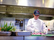 Adina Georgescu, Rheinland Inn dining facility cook, prepares vegetables Aug. 23 on Ramstein. The DFAC serves approximately 700 Airmen per day.