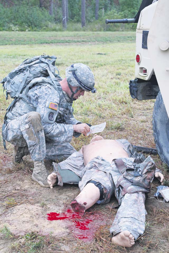 Photo courtesy of 55th Signal Company Combat Camera Sgt. 1st Class Ilker Irmak, U.S. Army Medical Command, demonstrates his marksmanship and tactical combat casualty care capabilities during a live-fire exercise on day three of the U.S. Army 2016 Best Warrior Competition Sept. 28 at Fort A.P. Hill, Virginia. The BWC is an annual weeklong event that tests 20 Soldiers from the 10 major commands Army-wide on their physical and mental capabilities.