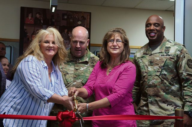 Mary Aguirre, Gold Star mother (left), Col. Keith E. Igyarto, U.S. Army Garrison Rheinland-Pfalz commander (middle left), Inge Colton, Gold Star family member (middle right), and Command Sgt. Maj. Edward J. Williams III, U.S. Army Garrison Rheinland-Pfalz command sergeant major, cut the ribbon for the relocation ceremony of the Army Community Service on Kleber Kaserne Oct. 3. The new location is Bldg. 3210 and serves as a family assistance center during deployments and offers Relocation Readiness, information, referral, Financial Readiness, Exceptional Family Member, Deployment/Mobilization Readiness, Family Action Plan and outreach programs.