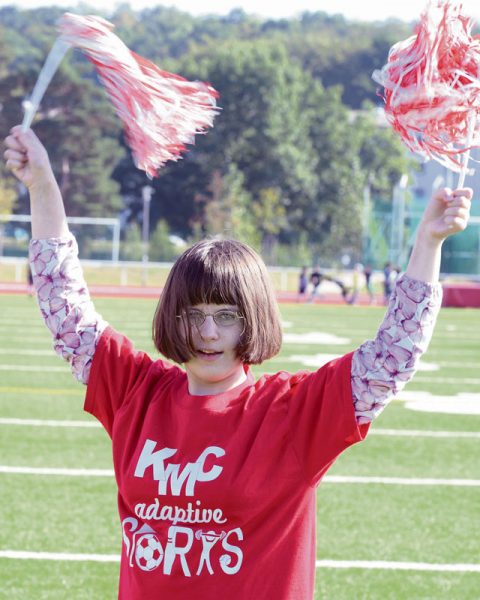 Erin Fairchild, Kaiserslautern Middle School student, cheers for her school’s team during an adaptive sports soccer game Sept. 22 on Vogelweh. While partaking in the adaptive sports program children can stay fit and work on social skills in a fun environment.