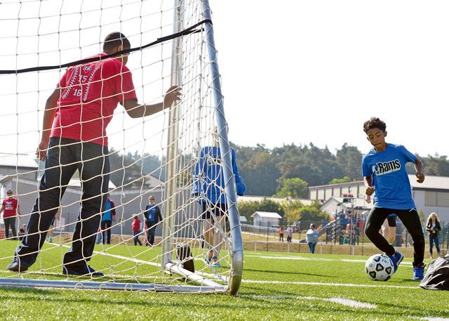 Elijah Muhammad, Ramstein Middle School student, prepares to take a shot on goal during an adaptive sports soccer game Sept. 22 on Vogelweh. Participating students from Ramstein and Kaiserslautern middle schools played two games of soccer before breaking for lunch.