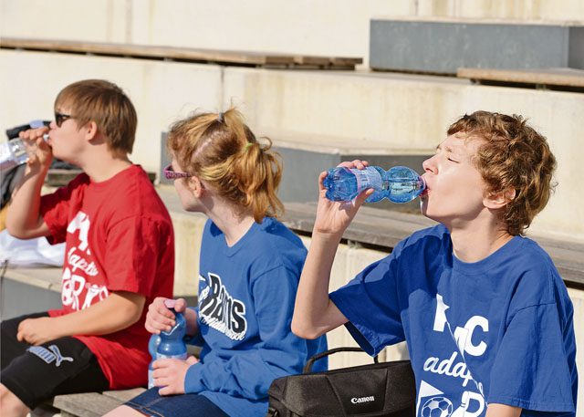 Students rehydrate during a break from an adaptive sports soccer game Sept. 22 on Vogelweh. The adaptive sports program provides children with disabilities an opportunity to live an active and healthy lifestyle.