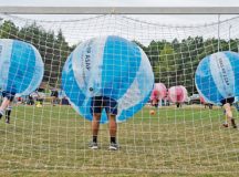 Airmen begin to charge at Soldiers during the kickoff for the Combined Federal Campaign-Overseas’ bubble soccer match Sept. 30 on Ramstein. The kickoff match provided Airmen, Soldiers and their families an opportunity to engage with the CFC-O and learn how they can contribute to helping the local community.