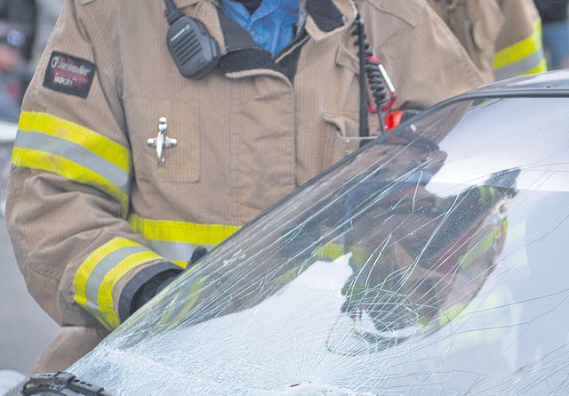 A firefighter assigned to the 786th Civil Engineer Squadron performs a vehicle extrication during an open house event training exercise Oct. 8 on Ramstein. Vehicle extrication is the process of removing a vehicle from around a person who has been involved in a motor vehicle accident when conventional means of exit are impossible or inadvisable.